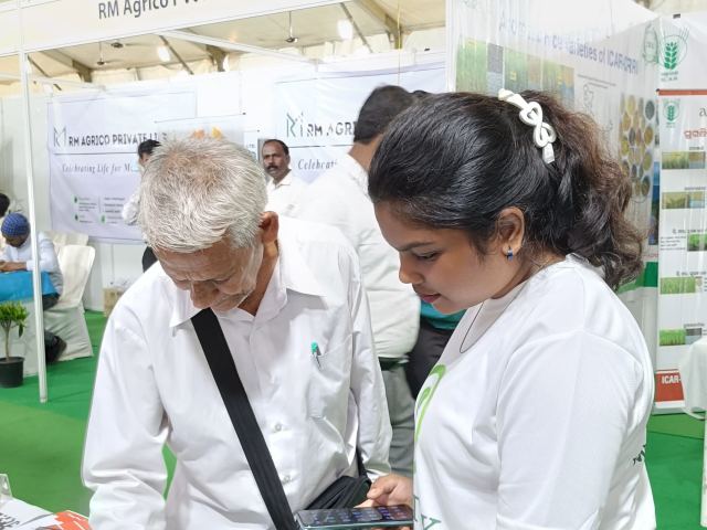 Talking to farmers at our stall